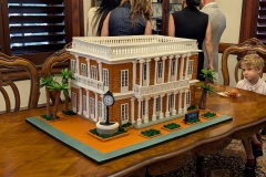 A decorative celebration cake on a table featuring an image of the historic Galveston Customhouse.